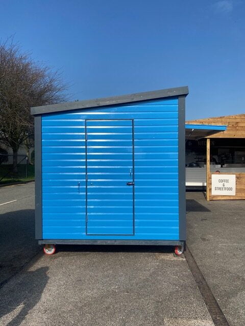 The Side Door of a Blue Wooden 4m x 2.4m Kiosk
