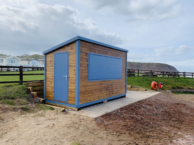 The Side of a Newly Built 4m x 2.4m Kiosk (Blue-Painted Door and Panel)