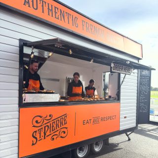 Festival catering stall with serving hatch and branded signage, ideal for outdoor food events