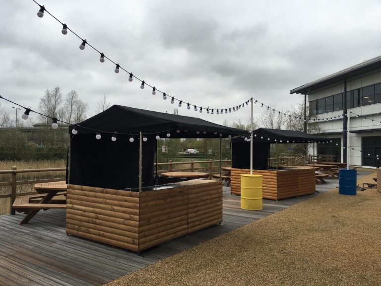 Flat-pack bar cart with castor wheels and high counter, designed for beer or prosecco service