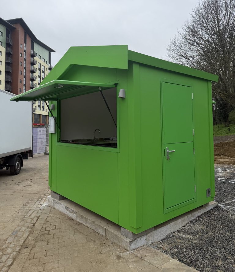green retail food kiosk with serving hatch